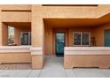 Inviting front door with a stylish teal door and welcome mat at 313 Haley Way # D, Mesquite, NV 89027