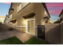 This charming patio area features brick pavers and artificial turf at 4625 Ridgeley Ave # 103, North Las Vegas, NV 89084