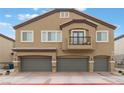 Beautiful two-story home featuring a three-car garage, balcony, and manicured landscaping at 4625 Ridgeley Ave # 103, North Las Vegas, NV 89084