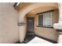 Inviting entryway features a covered archway, a window, and a secure front door at 4650 Chino Peak Ct, Las Vegas, NV 89139