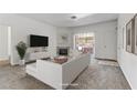 Bright living room featuring neutral decor, a decorative fireplace and comfortable seating at 4730 E Craig Rd # 1093, Las Vegas, NV 89115