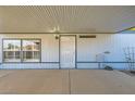This covered patio offers a comfortable outdoor living space and convenient access to the home's entrance at 518 Topaz Ave, Henderson, NV 89015