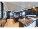 Spacious kitchen with granite countertops, stainless steel appliances, and a kitchen island at 7520 Jacaranda Bay St, Las Vegas, NV 89139