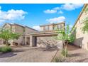 Beautiful two-story home with a two-car garage, desert landscaping and tile roof at 958 Harbor Ave, Henderson, NV 89002