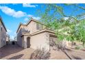 Attractive two-story home featuring an attached two car garage and desert landscaping at 958 Harbor Ave, Henderson, NV 89002