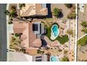Aerial view of a house with a pool, putting green, covered patio, and well-maintained landscaping at 9816 Gerald Ct, Las Vegas, NV 89134