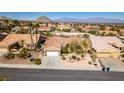 Wide angle shot of a single-story home featuring well-kept landscaping and a spacious two-car garage at 9816 Gerald Ct, Las Vegas, NV 89134
