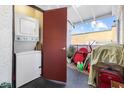 The image shows a laundry closet with a stacked washer and dryer at 1455 E Katie Ave # A21, Las Vegas, NV 89119