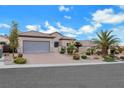Beautiful single-story home featuring desert landscaping, a spacious driveway and lovely curb appeal at 2365 Orangeburg Pl, Henderson, NV 89044