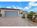 The home offers a spacious garage and brick paver driveway at 2365 Orangeburg Pl, Henderson, NV 89044