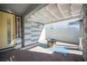 Inviting outdoor patio with brick flooring, pergola, and a cozy fire pit at 2514 Spergola St, Henderson, NV 89044