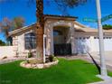 Inviting home with well-manicured landscaping and a spacious three-car garage, ready for a new Gathering at 297 Gingerbread St, Henderson, NV 89012