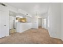 Bright living room featuring an open floorplan with views into the kitchen and dining area at 3400 Cabana Dr # 2103, Las Vegas, NV 89122
