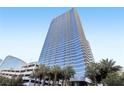 Striking full exterior view of a high-rise condo building with palms at 4471 Dean Martin Dr # 2605, Las Vegas, NV 89103