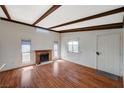 Open-concept living room featuring wood floors, fireplace and natural lighting at 4706 Obannon Dr # C, Las Vegas, NV 89102