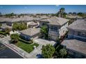 Aerial view of the neighborhood showcasing the home's location with palm trees and mountain views at 504 Pinnacle Heights Ln, Las Vegas, NV 89144