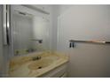 Small bathroom featuring a single sink vanity with a mirror and a towel bar at 5612 W Lake Mead Blvd, Las Vegas, NV 89108