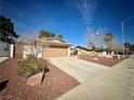 Charming single-story home featuring a two-car garage and desert landscaping for low maintenance at 6412 Churchfield Blvd, Las Vegas, NV 89103