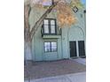 Two-story townhome showcasing dual entry doors and a quaint balcony, all set against a backdrop of low-maintenance landscaping at 7095 Burcot Ave # F83, Las Vegas, NV 89156
