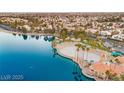 Picturesque aerial view of community lake with beach and recreational area at 7944 Marbella Cir, Las Vegas, NV 89128