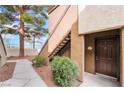 The entrance to unit 1043 showing the front door and lush landscaping and sidewalk at 9000 Las Vegas Blvd # 1043, Las Vegas, NV 89123