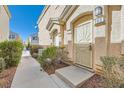 Charming townhouse entrance featuring a decorative security door and well-maintained landscaping at 9314 Indian Corn Ct # 102, Las Vegas, NV 89178