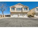 Attractive townhouse complex with three garage spaces, showcasing clean architecture and ample parking at 9314 Indian Corn Ct # 102, Las Vegas, NV 89178
