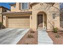 Beautful elevation with a two-car garage and and lovely entry at 10316 Northern Hills Ave, Las Vegas, NV 89166