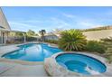 Beautiful backyard featuring a private pool and spa with a spacious patio area, perfect for outdoor relaxation at 10638 La Spezia Way, Las Vegas, NV 89141