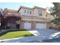Charming two-story home featuring a three-car garage, desert landscaping, and a modern design at 10657 Blue Nile Ct, Las Vegas, NV 89144