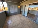 Private tiled patio featuring sliding glass doors and natural light at 1460 Hialeah Dr # D, Las Vegas, NV 89119
