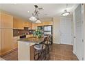 Well-equipped kitchen featuring granite countertops, stainless steel appliances, and a convenient breakfast bar at 2405 W Serene Ave # 631, Las Vegas, NV 89123
