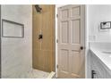 Modern shower features decorative tile, niche, and sleek black fixtures at 3104 Waterview Dr, Las Vegas, NV 89117