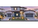 Charming two-story home with symmetrical design, desert landscaping and a three-car garage at 32 Grand Corniche Dr, Henderson, NV 89011