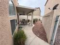 Charming covered patio featuring a dining set and well-maintained landscaping at 3331 Cheltenham St, Las Vegas, NV 89129