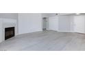 Bright living space with fireplace, neutral walls, and easy access to other rooms at 4820 Grey Wolf Ln # 101, Las Vegas, NV 89149
