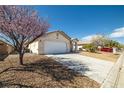 Single story home with desert landscaping, two car garage and extended driveway at 5050 Nw Valdez Ct, Pahrump, NV 89060