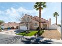 Inviting two-story home with lush landscaping, offering great curb appeal and a welcoming atmosphere at 629 Newbridge Way, North Las Vegas, NV 89032