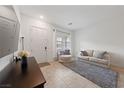 Cozy living room featuring stylish furniture, neutral colors, and ample natural light at 7544 Nicklin St, Las Vegas, NV 89143