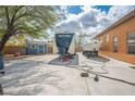 Large backyard featuring RV, boat, shed, and concrete pad ready for all your toys at 7685 Gilespie St, Las Vegas, NV 89123