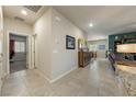 Bright hallway features neutral tones, tile flooring, and seamless transition to living areas at 91 Hawk Ave, Pahrump, NV 89060
