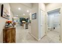 Bright hallway showing tile flooring, with sightlines to a bathroom and living spaces at 91 Hawk Ave, Pahrump, NV 89060