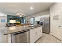 Modern kitchen island with granite countertops and stainless steel appliances at 91 Hawk Ave, Pahrump, NV 89060