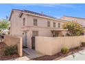 Charming townhome with a private patio, gated entrance, and manicured landscaping at 9555 Belle Fountain Ave, Las Vegas, NV 89123