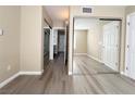 Spacious bedroom with wood-look flooring and mirrored closet doors at 8070 W Russell Rd # 2070, Las Vegas, NV 89113