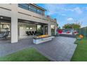 An outdoor living space features a modern fire pit and outdoor seating at 1168 Spago Ln, Henderson, NV 89052