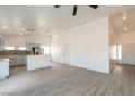 Open-concept living room and kitchen with breakfast bar, recessed lighting, and wood-look floors at 2128 La Salle St, Las Vegas, NV 89106