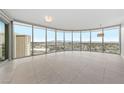 Open living area featuring tile floors and a wall of windows with city views at 222 Karen Ave # 1908, Las Vegas, NV 89109