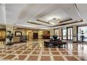 Grand lobby entrance boasting tile floors, elegant decor and a cozy seating area at 30 Strada Di Villaggio # 118, Henderson, NV 89011
