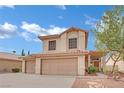 Charming two-story home featuring three car garage, stone pathway, and desert landscaping at 3113 Saint Tropez St, Las Vegas, NV 89128
